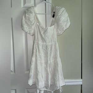 White eye-lit mini dress